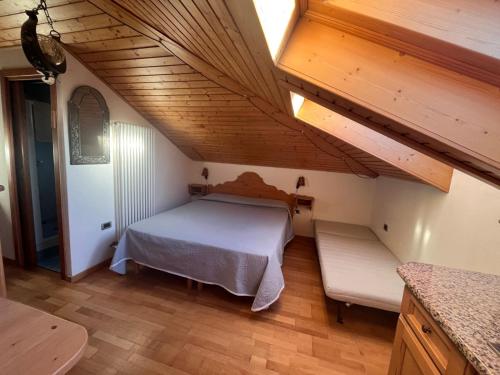 Postel nebo postele na pokoji v ubytování Mansardina Il Nido