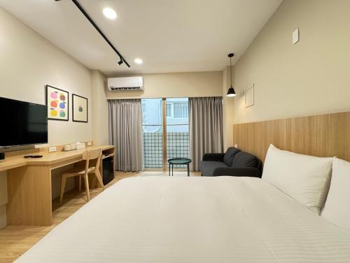 Giường trong phòng chung tại Yoshi Hotel Xinmei Street