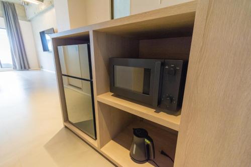 a wooden cabinet with a tv in it at Visionary Stay HINODE in Tokyo