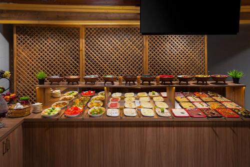 a buffet line with many different types of food at Premium Cappadocia House in Goreme