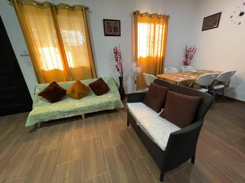a living room with a couch and a table at Mountain Retreat in Chiriqu, Panama - Your Home Away from Home in Mata Francés