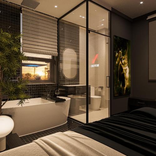 a bedroom with a bathroom with a tub and a sink at inluv hotel in Long Xuyên