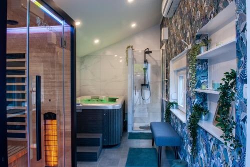 a bathroom with a shower and a sink at Oaza Mira LAZE in Nova Gradiška