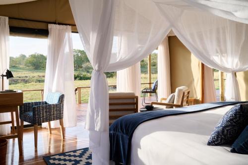 Ένα ή περισσότερα κρεβάτια σε δωμάτιο στο Tambarare Camp, an A&K Sanctuary