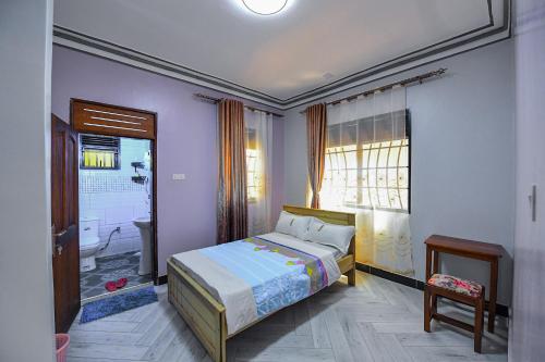 Postel nebo postele na pokoji v ubytování Peacewell Home