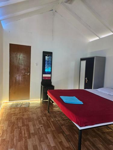 Ένα ή περισσότερα κρεβάτια σε δωμάτιο στο Bhakti Yogshala