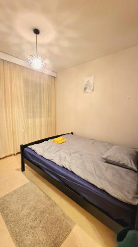 Giường trong phòng chung tại Lahti Central Home-kaksio