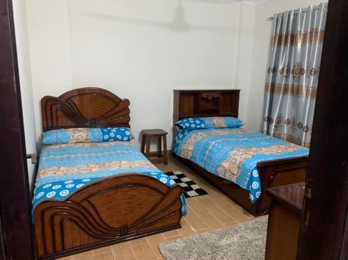 Ένα ή περισσότερα κρεβάτια σε δωμάτιο στο Urban Haven Dar Misr