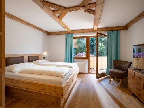 Postel nebo postele na pokoji v ubytování Hotel Gasthof Felsenkeller