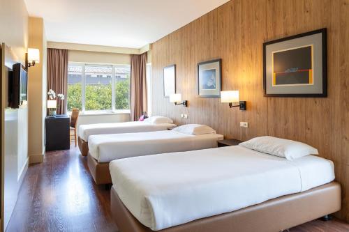 Ένα ή περισσότερα κρεβάτια σε δωμάτιο στο Hotel Fundador