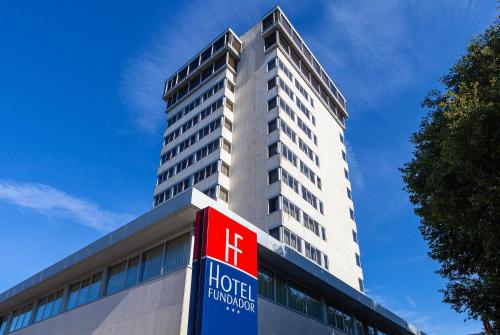 a hotel building with a sign in front of it at Hotel Fundador in Guimarães