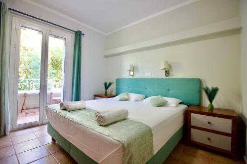 Ένα ή περισσότερα κρεβάτια σε δωμάτιο στο Aggelina's Apartments