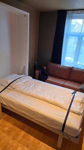 Postel nebo postele na pokoji v ubytování The Guest Apartment