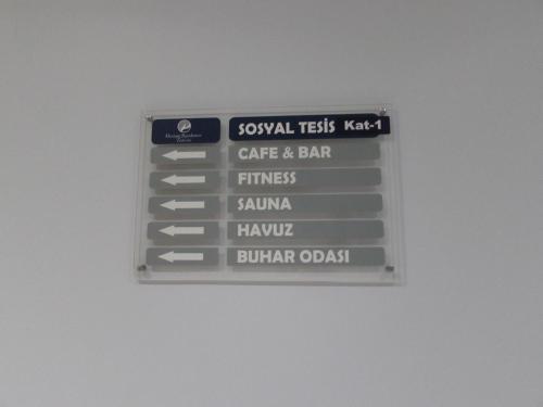 a sign for a cafe and bar on a wall at Modern Comfort Steps from Taksim in Istanbul