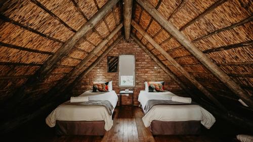 Postel nebo postele na pokoji v ubytování Teri-Lemveli Lodge