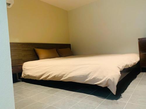 a bedroom with a large bed in a room at Châu Home in Ninh Binh