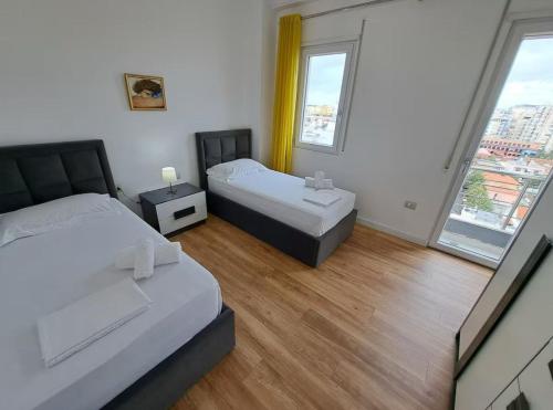 Voodi või voodid majutusasutuse Tirana Verve Stay toas