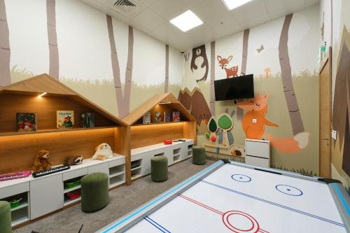 a childs play room with a large trampoline at Sheraton Astana Hotel in Astana