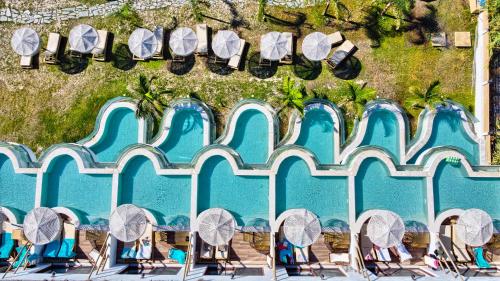 an aerial view of a pool at a resort at Alia Beachfront Suites and Spa in Haraki