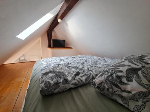 a bedroom with a bed in a attic at Studio Apartment for 1-2 People with Rhine View in Rüdesheim am Rhein