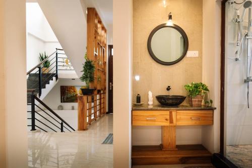 a bathroom with a sink and a mirror on the wall at Sapphire Escape - Private Villa in Ambalangoda in Ambalangoda