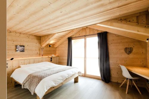 Ένα ή περισσότερα κρεβάτια σε δωμάτιο στο Chalet Cerf Blanc