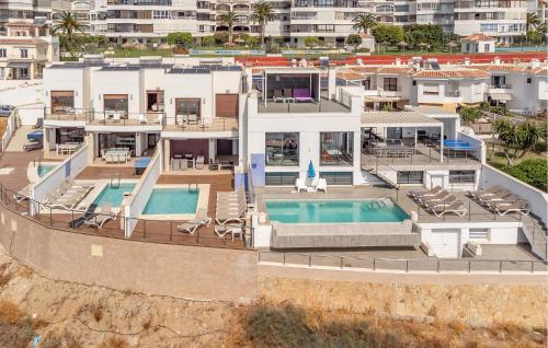 an aerial view of a house with a swimming pool at Cozy Home In Torrox Costa in Torrox Costa