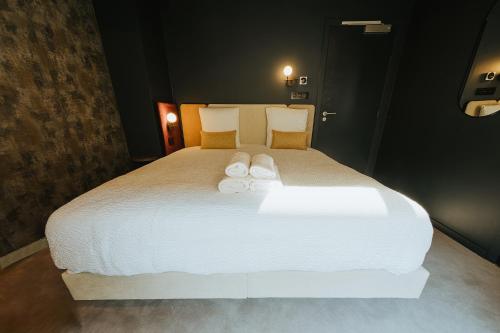 Ένα ή περισσότερα κρεβάτια σε δωμάτιο στο Kouter House