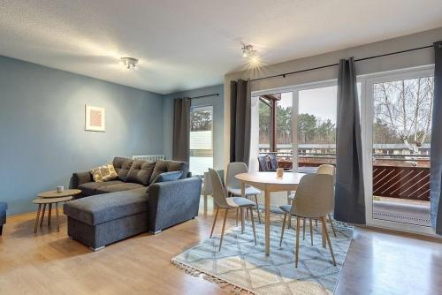 a living room with a couch and a table at Fewo Melli in Zempin