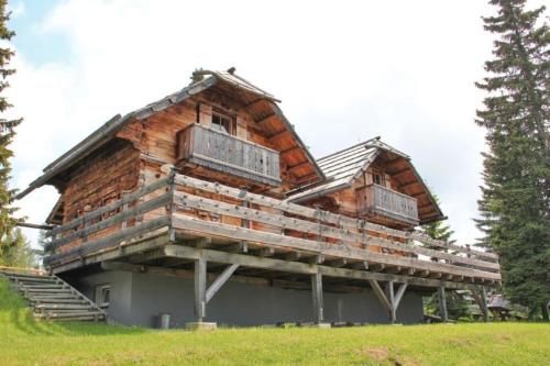 a log cabin with a gambrel roof at Alpine-Lodges Matthias in Hintersauerwald