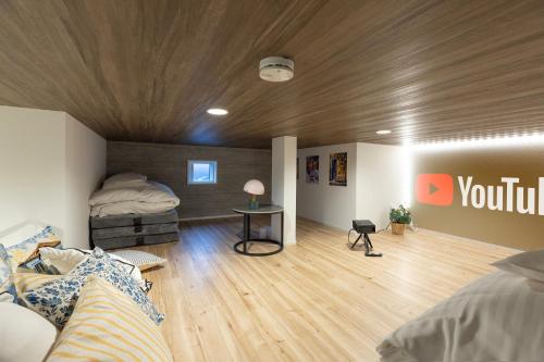 a room with a bedroom with a bed and a table at Hotel Star Residence 3 WEST in Fukuoka