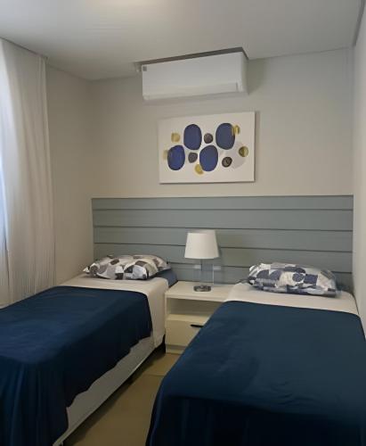 Postel nebo postele na pokoji v ubytování FReNTe MaR DeSLuMBRaNTe em ITaJuBa 2