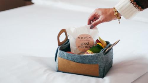 a hand reaching into a bag filled with toys at beppo Restaurant Boutique-Hotel in Backnang