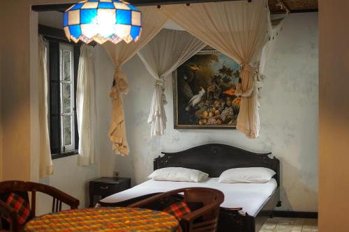 Ένα ή περισσότερα κρεβάτια σε δωμάτιο στο Adams homestay