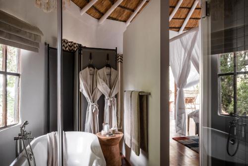 Ένα ή περισσότερα κρεβάτια σε δωμάτιο στο Sussi & Chuma Lodge, an A&K Sanctuary