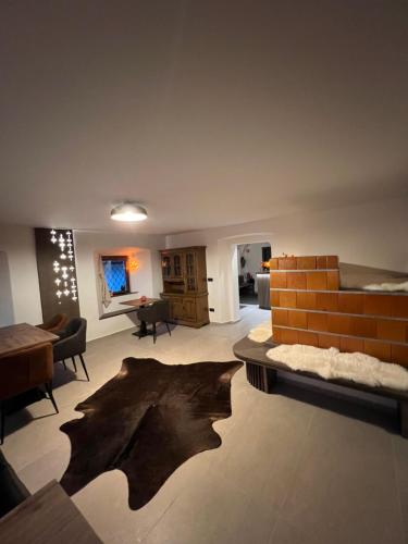 a living room with a couch and a table at 4 Elements Glamping & Apartments in Bled