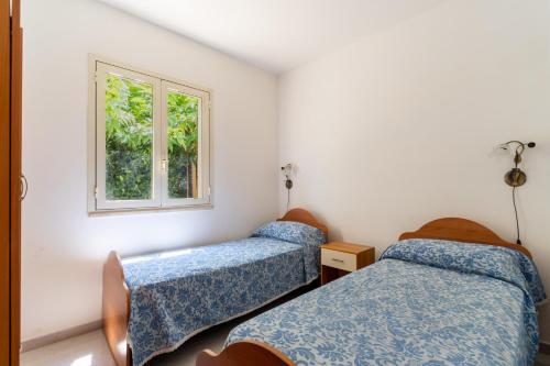 Postel nebo postele na pokoji v ubytování Villetta Irlanda