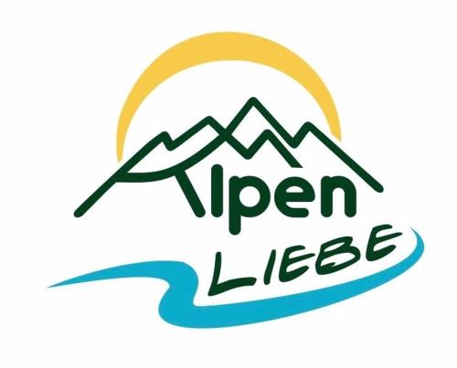 a logo for a river lodge with mountains in the background at Alpenliebe in Windischgarsten
