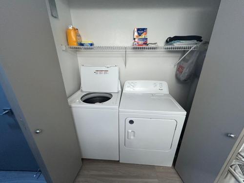 a washer and dryer in a small room at Very spacious 1Bed 1Bath Unit in Saint-Louis