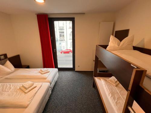 Ένα ή περισσότερα κρεβάτια σε δωμάτιο στο Jugendherberge Düsseldorf