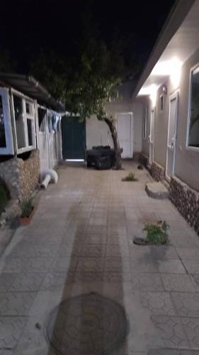 a driveway of a house at night with a car parked at Sinichka in Cholpon-Ata