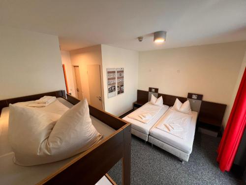 Ένα ή περισσότερα κρεβάτια σε δωμάτιο στο Jugendherberge Düsseldorf