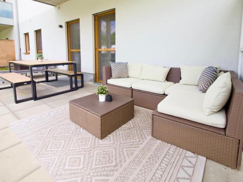 a living room with a couch and a table at Watzmann Panorama in Berchtesgaden