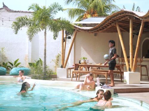 a group of people in a swimming pool at Tipsea Turtle Gili Trawangan in Gili Trawangan