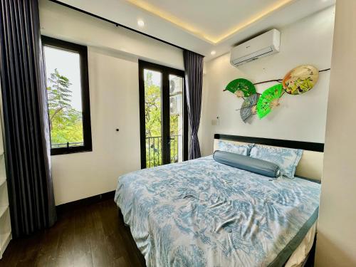 Ένα ή περισσότερα κρεβάτια σε δωμάτιο στο CONIHOUSE - Homestay & Villa