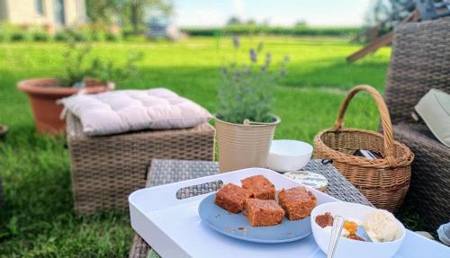 a table with a plate of food on it at Noclegi nad Biebrzą Stara Szkoła in Wroceń