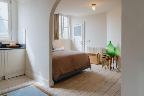 Ένα ή περισσότερα κρεβάτια σε δωμάτιο στο Cozy Hideaway Near the Heart of Antwerp