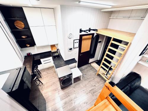 an overhead view of a room with a table and chairs at The All-in-One Loft in Ulaanbaatar