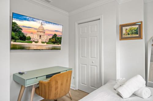 a room with a desk and a bed at - 5-Min Walk To Metro - Free Prking - Escape in Alexandria