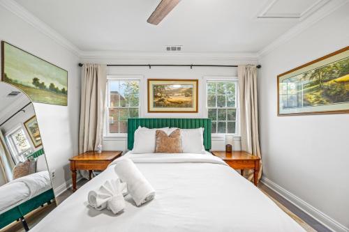 a bedroom with a large bed and two windows at - 5-Min Walk To Metro - Free Prking - Escape in Alexandria